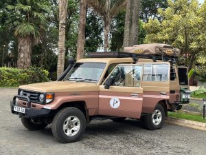 Toyota Land Cruiser LX with a roof top tent